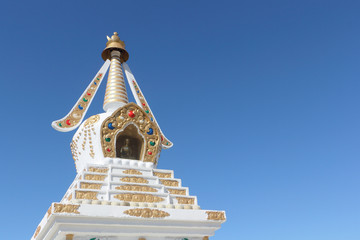 Buddhist stupa  against the background of the blue sky, a detail