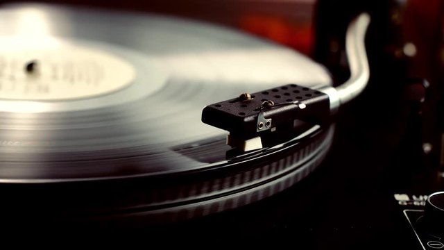 Old vinyl turntable playing music