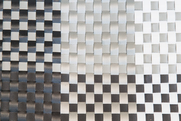 Woven plastic background in black and white.