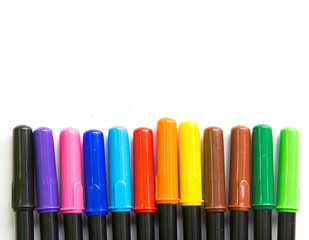 Colour pens on white background , free space for text.