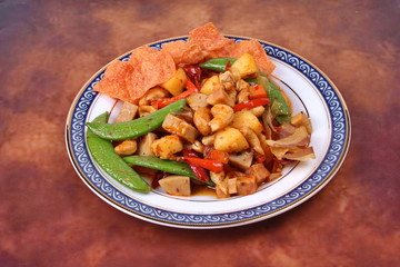 Fried mixed fruit and vegetable with roasted chili plate .