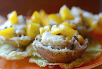 Baked potatoes stuffed with mushrooms, pepper and cheese
