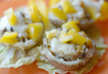Baked potatoes stuffed with mushrooms, pepper and cheese