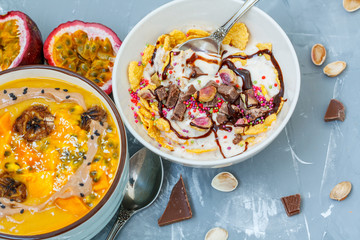 Vegan breakfast: smoothie bowls with chocolate and tropical fruits. Love for a healthy vegan food concept
