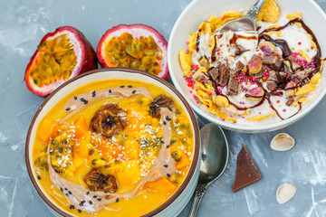 Vegan breakfast: smoothie bowls with chocolate and tropical fruits. Love for a healthy vegan food concept