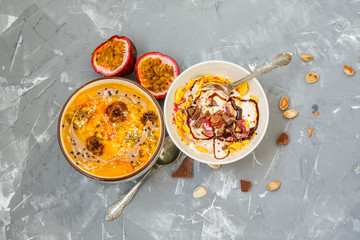 Vegan breakfast: smoothie bowls with chocolate and tropical fruits. Love for a healthy vegan food concept