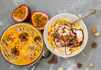 Vegan breakfast: smoothie bowls with chocolate and tropical fruits. Love for a healthy vegan food concept