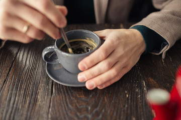 Fototapeta na wymiar Closeup - strew sugar in a cup of coffee