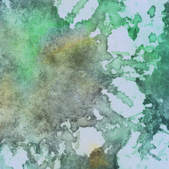 Abstract hand drawn watercolor background on textured paper in green shades 