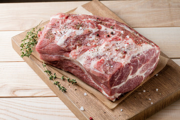 Photo of raw meat. Pork neck with herbs