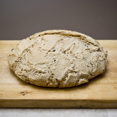 Homemade round bread on wooden 