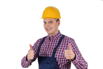 Smiling young engineer showing thumb up