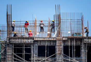 Construction workers steel binding wire