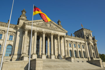 flag of the Federal Republic of Germany and entrance of the national german parliament (Reichstag,...