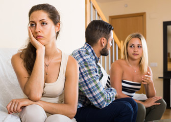 person keeping silence turned away from friends