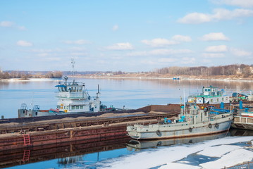 small port with boats in the spring Volga River in the ancient Russian town of Uglich