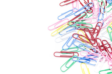 multi-colored paper clips on white background