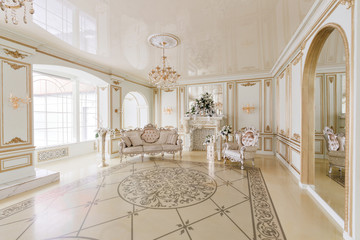 Luxurious vintage interior with fireplace in the aristocratic style