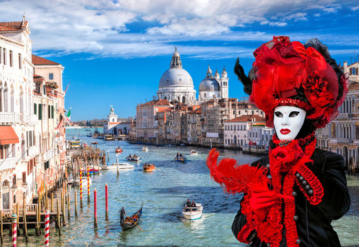Famous Carnival mask against Grand Canal in Venice, Italy