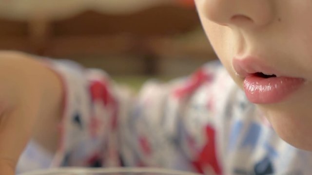 little boy having breakfast at home, slow motion