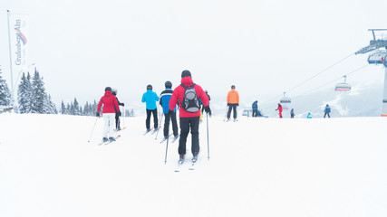 Skiers on hill