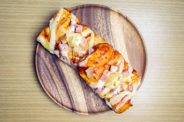 pizza on wooden plate