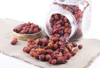 Dried rosehip berries in glass jar
