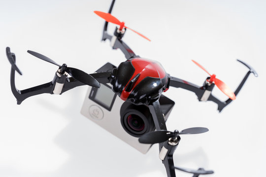 Quadcopter drone with camera isolated on a white background