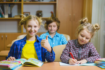 children on the geography lesson in school classroom. Educational concept