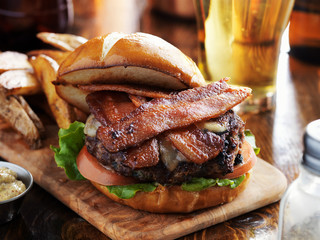 bacon burger with pretzel bun and beer © Joshua Resnick