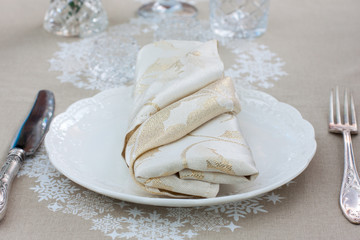 Beautiful holiday table setting in white color