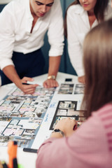 Close up hands of professional architects discussing the project