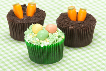 Easter Cupcakes. Homemade. Decorated With Candy Carrots, Chocola