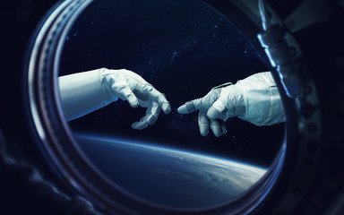 Michelangelo God's touch. Close up of human hands touching with fingers in space. Elements of this...