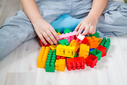 child playing in a colorful constructor