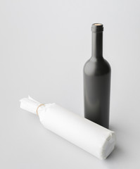 Two wine bottle are standing on gray background