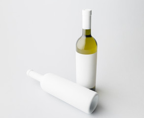 Two wine bottle are standing on gray background