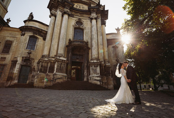 Romantic couple in front of the beautiful church