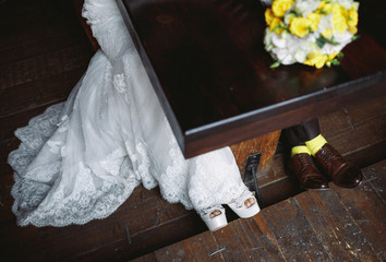 Lace bridal dress, heels and groom's shoes