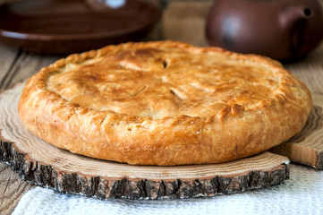 Flacky dough pie with meat and vegetables
