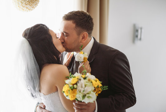 Romantic kiss in the hotel in the wedding day