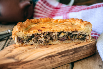Flacky dough pie with meat and vegetables