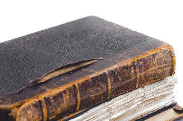 Closeup of few ancient antiquarian vintage books with leather binding more then 100 years old on a...