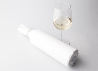 Wine bottle and wine glass on a gray background