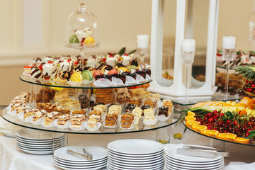 Cut cakes served on tired glass dish