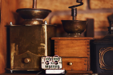 Wedding rings lie on old tape-recorder