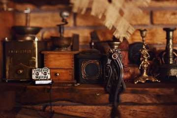Fototapeta na wymiar Old tape-recorder with wedding rings lies on the shelf with antiques