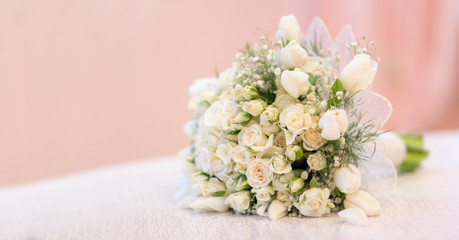The bride's bouquet, white roses, tulips, delicate flowers, use as background or texture, soft pastel colors