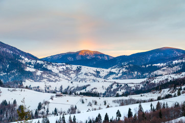 Rainbow View of winter cold mountains at dawn wooden fence in sn