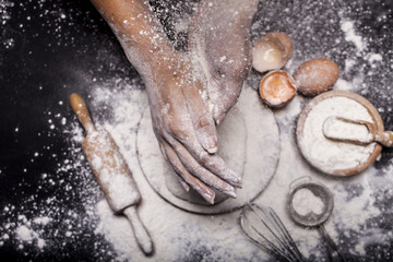 Fototapeta premium Baker prepares bread.